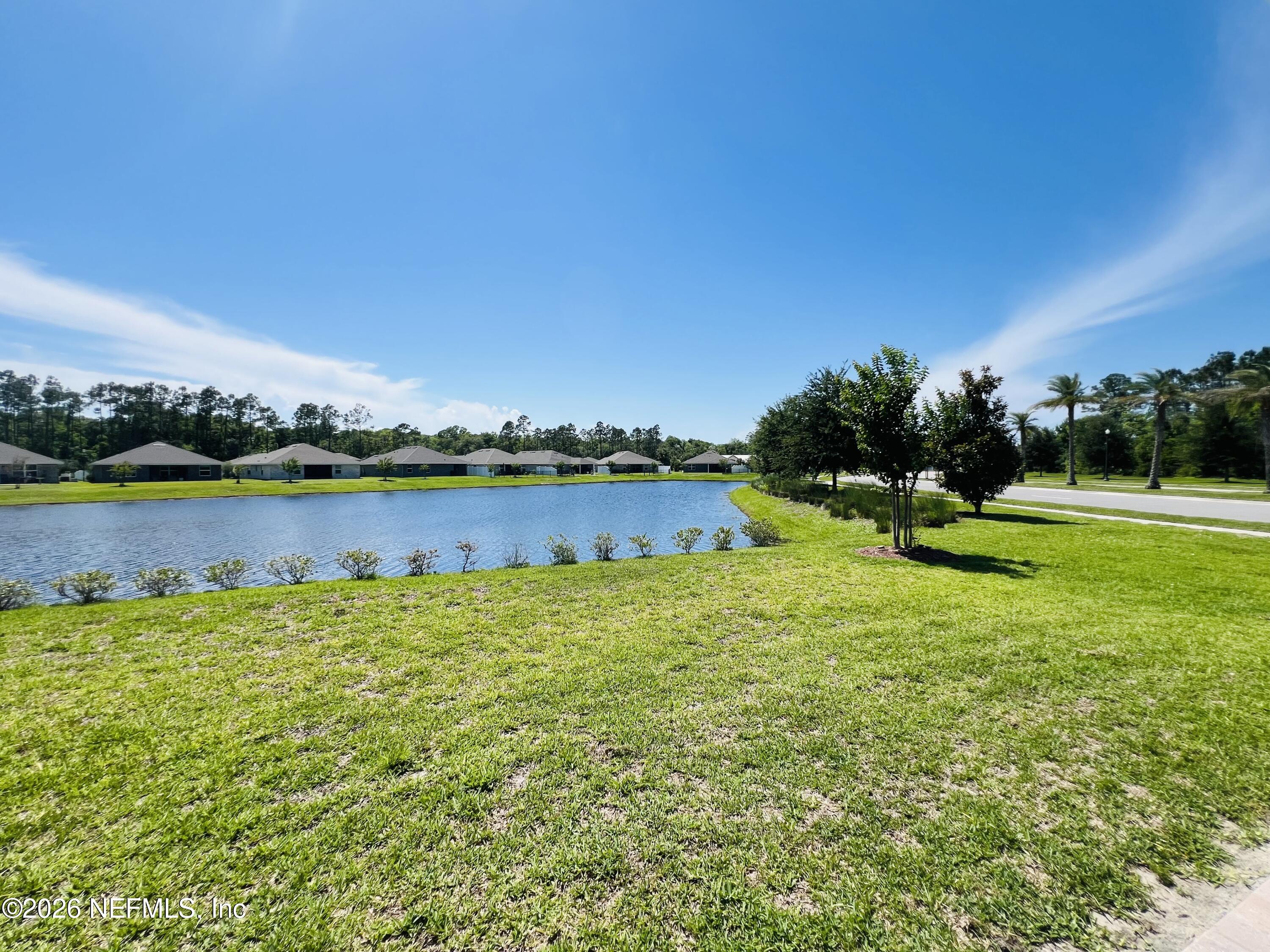 2 Rivertown Road Palm Coast, FL 32137 - Photo 78 of 80 a view of a lake with houses in the back
