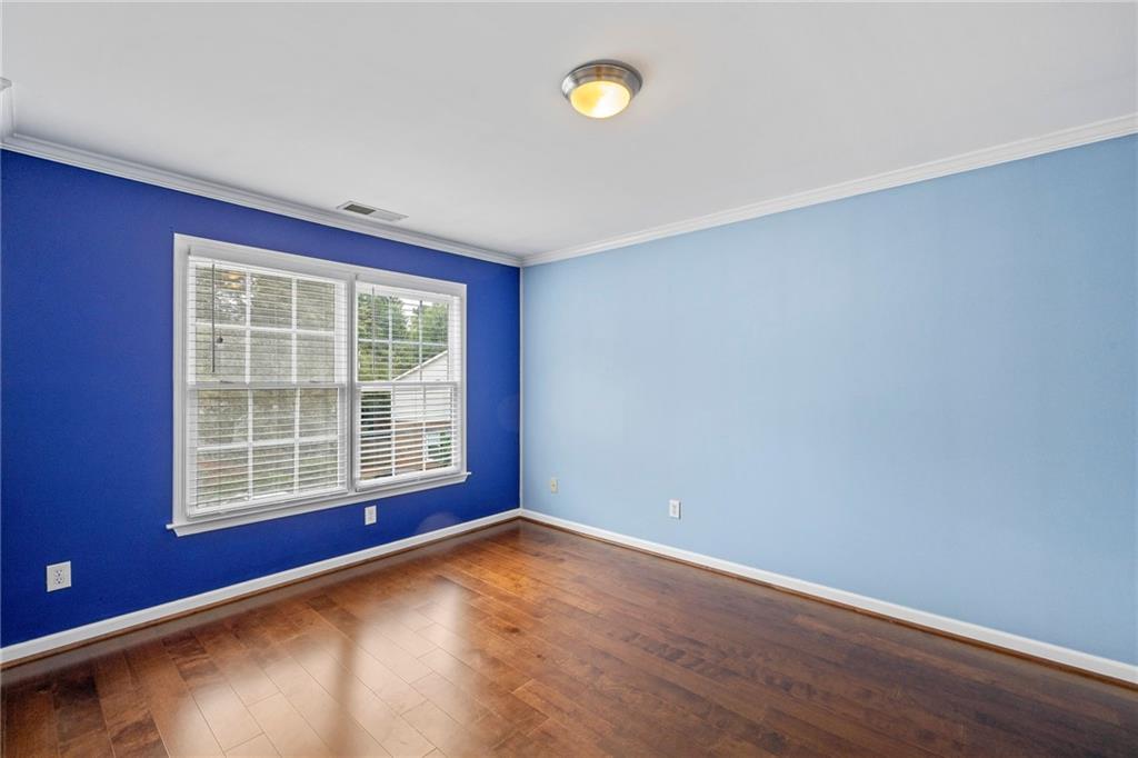 5323 Sherwin Drive Norcross, GA 30093 - Photo 11 of 20 an empty room with wooden floor and windows