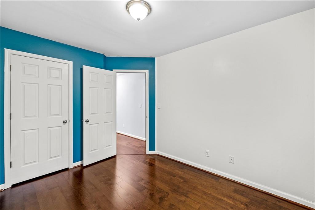 5323 Sherwin Drive Norcross, GA 30093 - Photo 14 of 20 an empty room with wooden floor