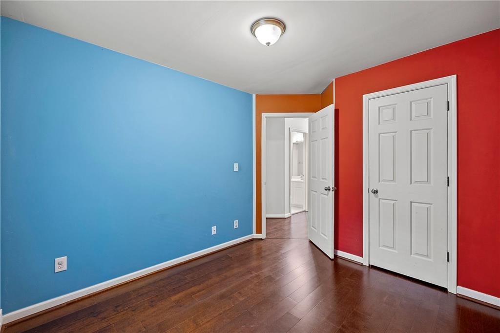 5323 Sherwin Drive Norcross, GA 30093 - Photo 16 of 20 a view of an empty room with wooden floor