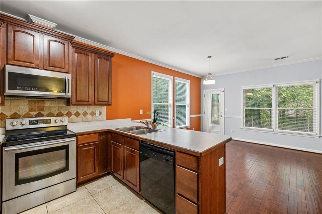 5323 Sherwin Drive Norcross, GA 30093 - Photo 5 of 20 a kitchen with a sink stove top oven and microwave