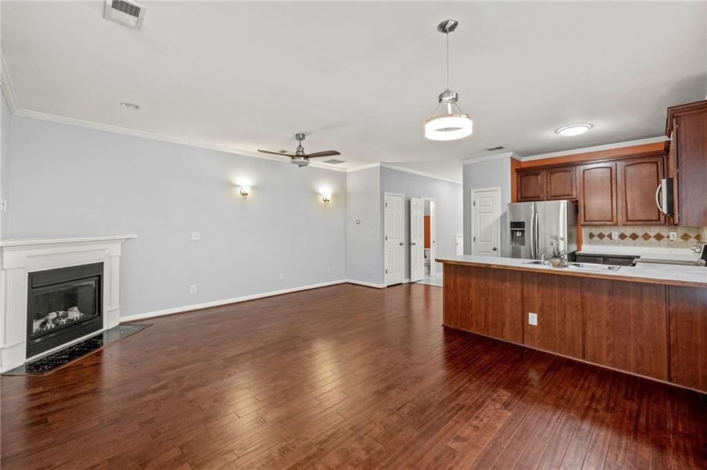 5323 Sherwin Drive Norcross, GA 30093 - Photo 6 of 20 a kitchen with stainless steel appliances granite countertop a refrigerator a sink dishwasher a stove and a wooden floor