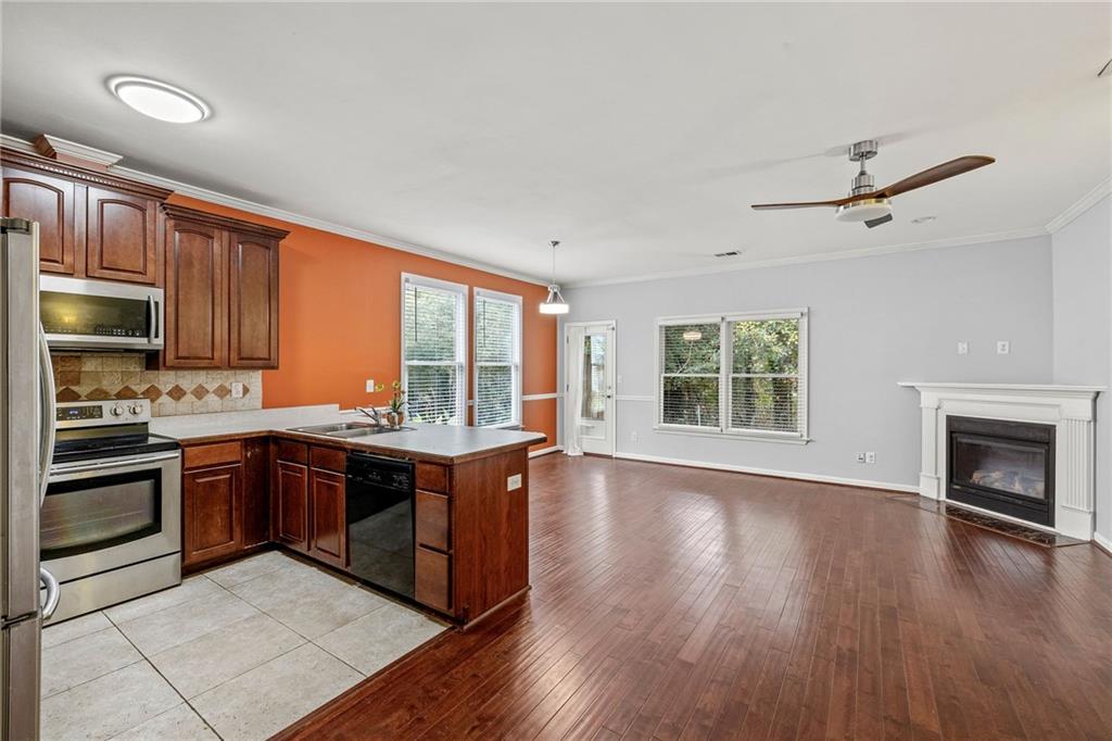 5323 Sherwin Drive Norcross, GA 30093 - Photo 7 of 20 a kitchen with stainless steel appliances granite countertop a stove and a sink