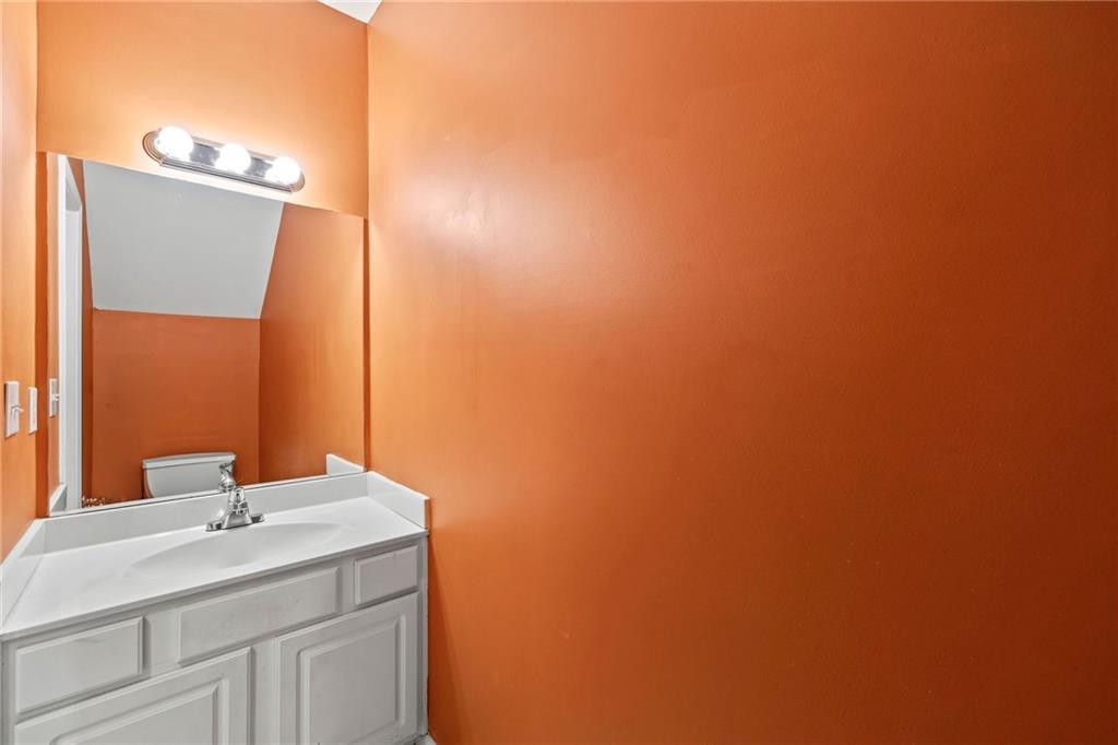 5323 Sherwin Drive Norcross, GA 30093 - Photo 8 of 20 a bathroom with a sink and a mirror
