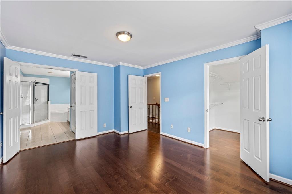 5323 Sherwin Drive Norcross, GA 30093 - Photo 9 of 20 a view of an empty room with wooden floor and a window