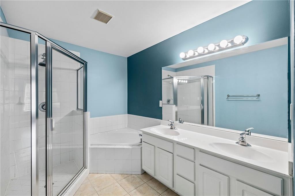 5323 Sherwin Drive Norcross, GA 30093 - Photo 10 of 20 a bathroom with a double vanity sink and a mirror