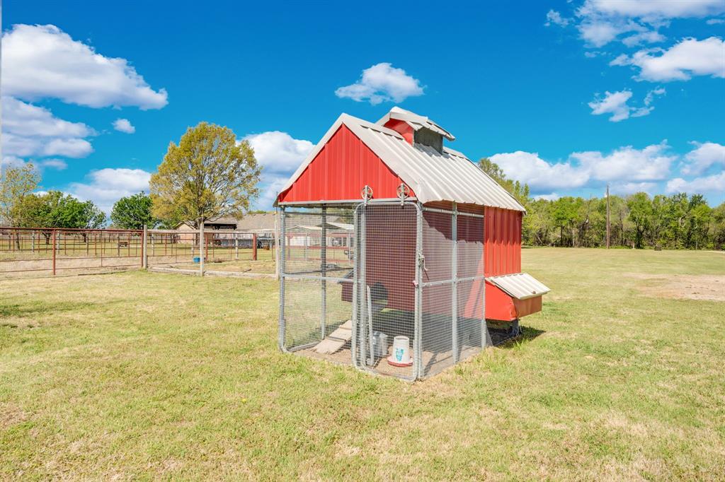 130 Eubanks Road Maypearl, TX 76064 - Photo 3 of 39 a backyard of a house with table and chairs