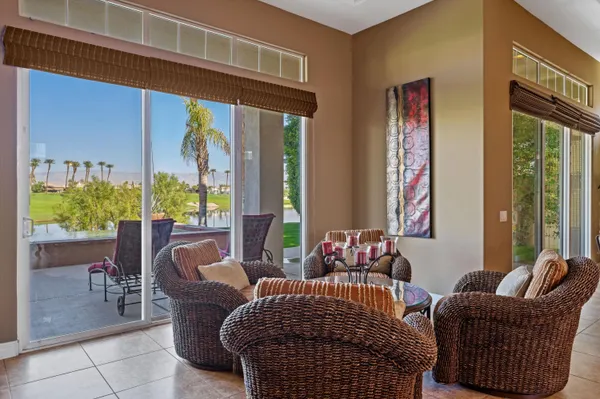 a view of a dining room with furniture window and outside view