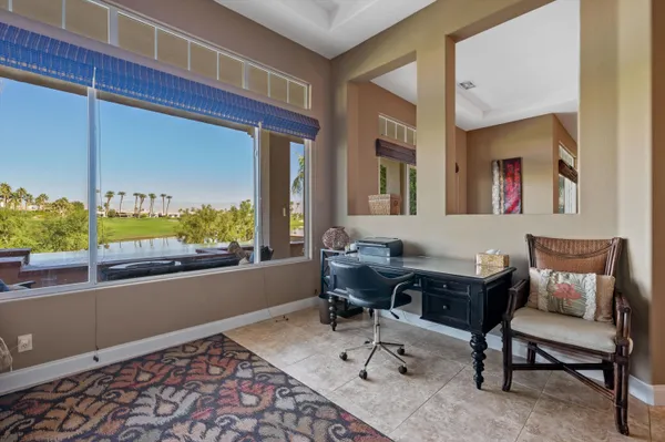 a bathroom with a sink double vanity granite and a mirror