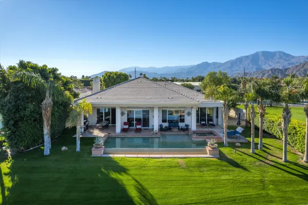 a view of a chairs and table in patio