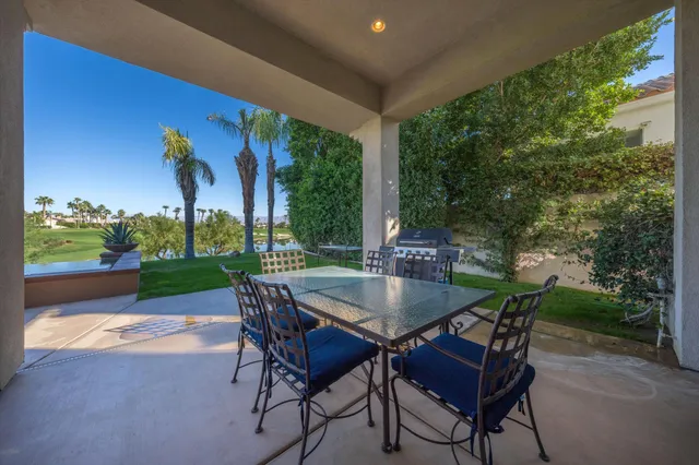 a view of a yard with furniture