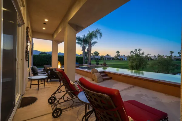 a view of a patio with swimming pool