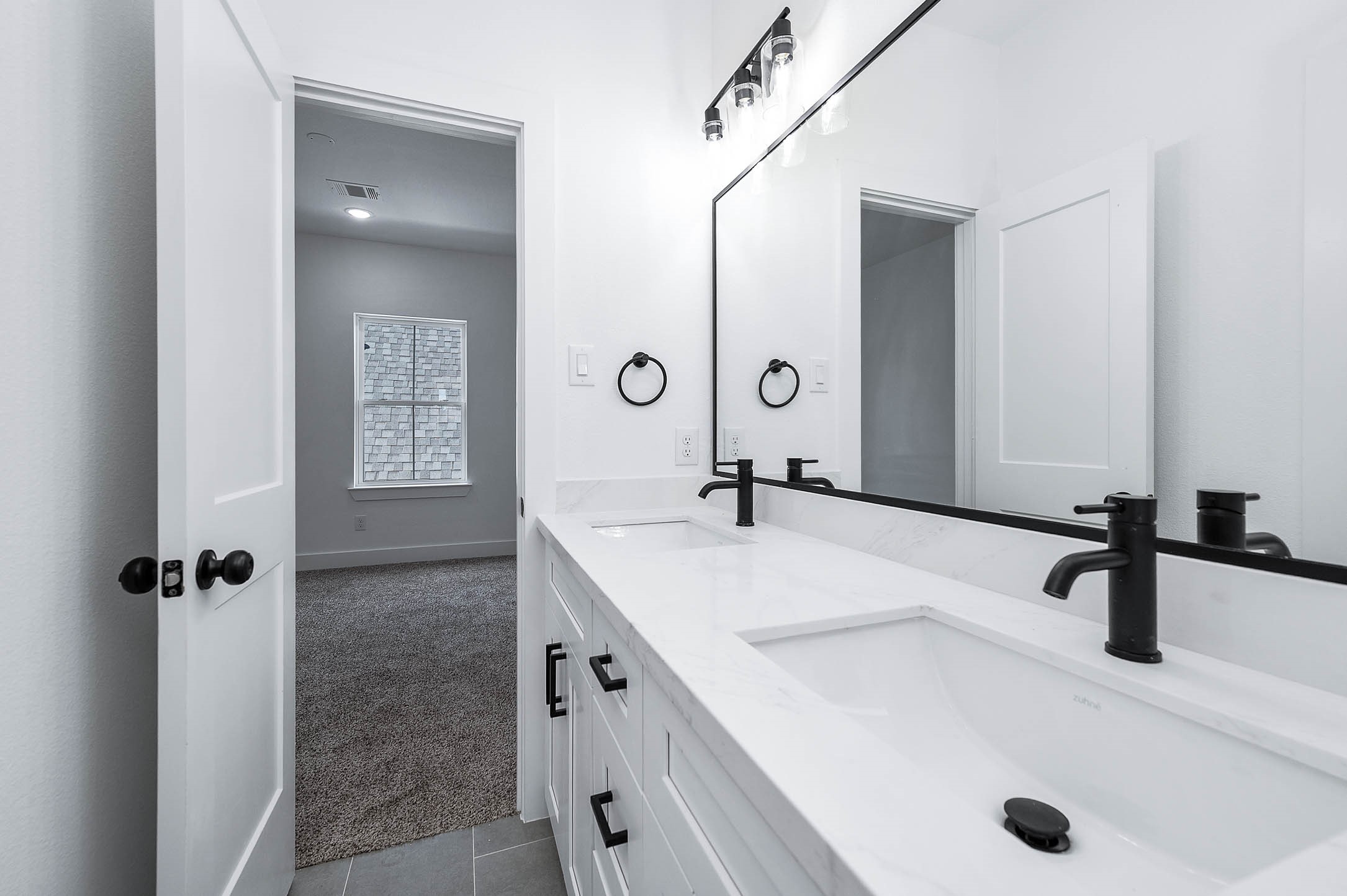 1515 Euel Street Houston, TX 77009 - Photo 22 of 34 Spacious bathroom with dual sinks and contemporary finishes designed for both comfort and convenience.