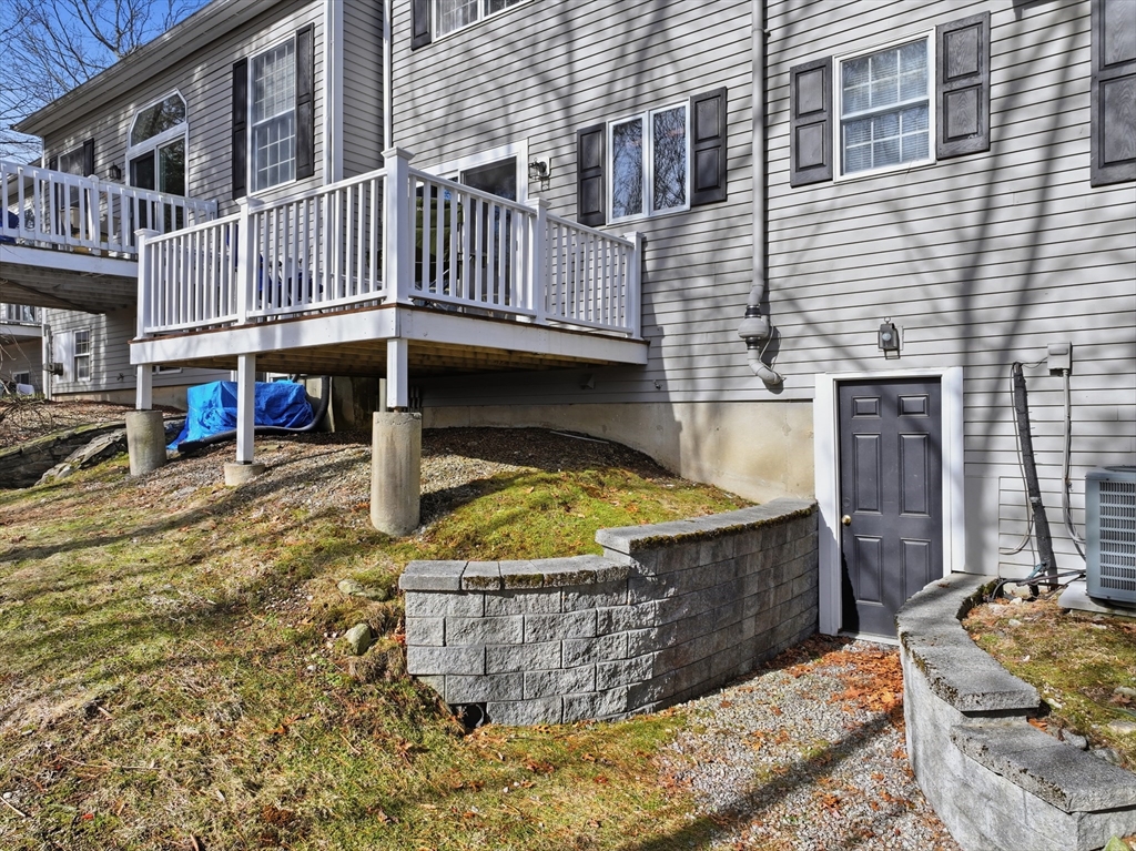 202 Torrey Ln Extension, Unit 202 Holden, MA 01520 - Photo 28 of 32 a view of a house with wooden fence