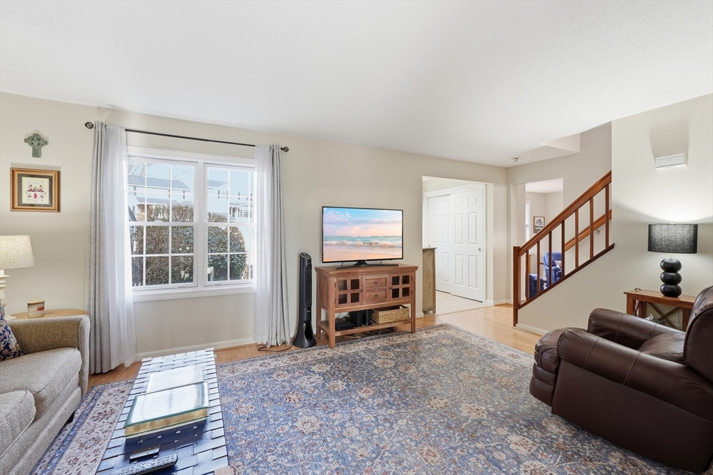 202 Torrey Ln Extension, Unit 202 Holden, MA 01520 - Photo 7 of 32 a living room with furniture and a window
