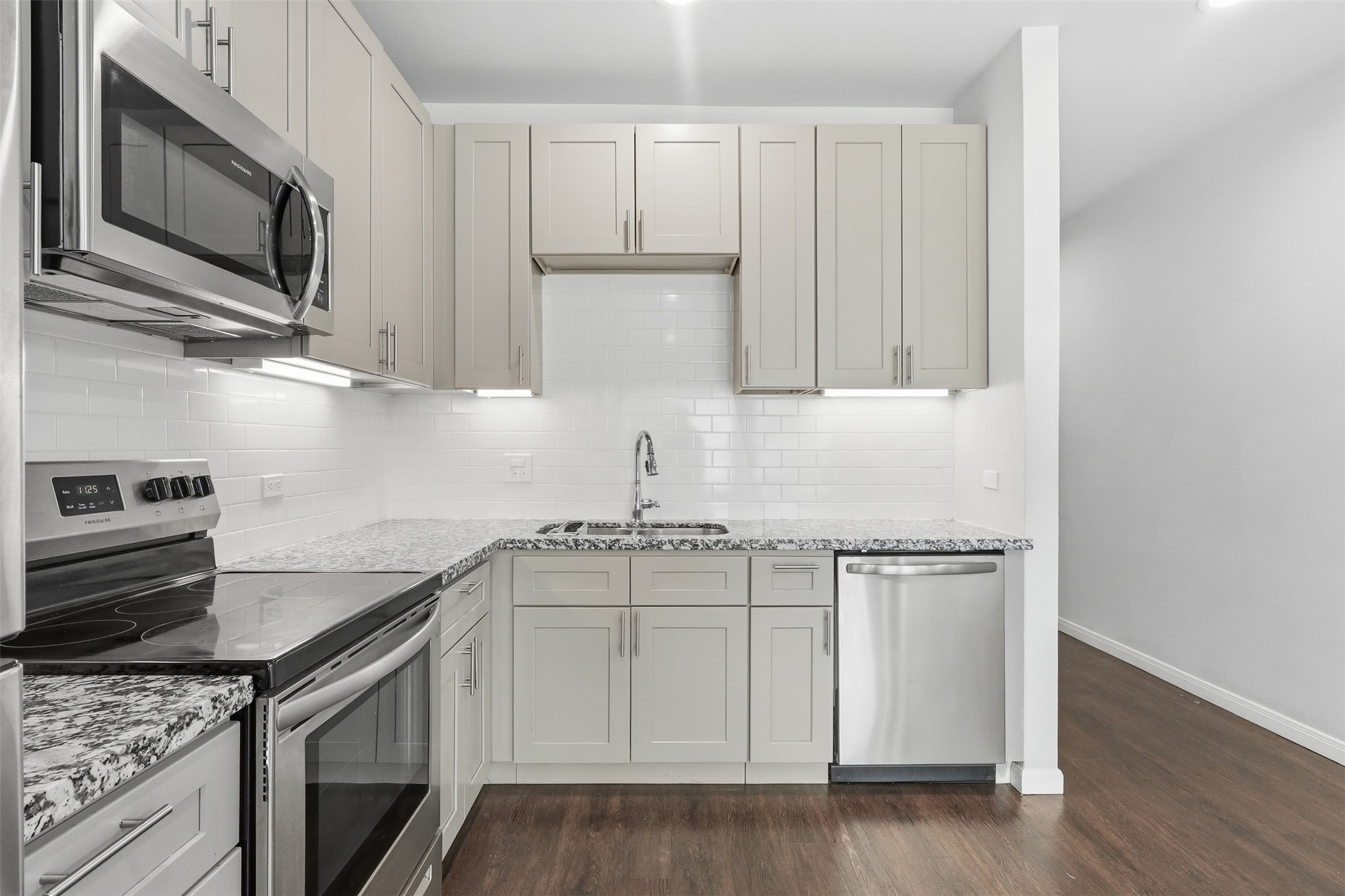 4937 Ambient Dr Spring Spring, TX 77379 - Photo 4 of 16 Open concept kitchen with stainless steel electric appliances