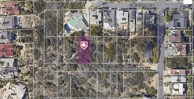 a street sign on a wall next to a building