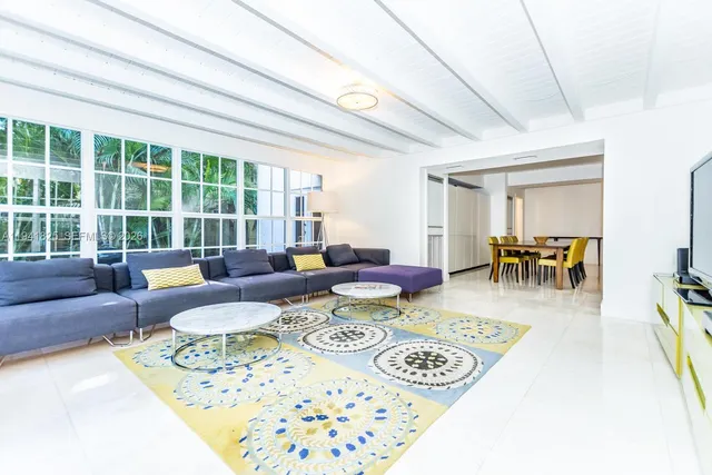 a view of a house with swimming pool and sitting area