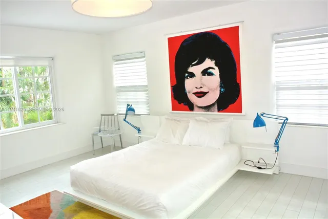 a view of a bathroom with a sink and a mirror