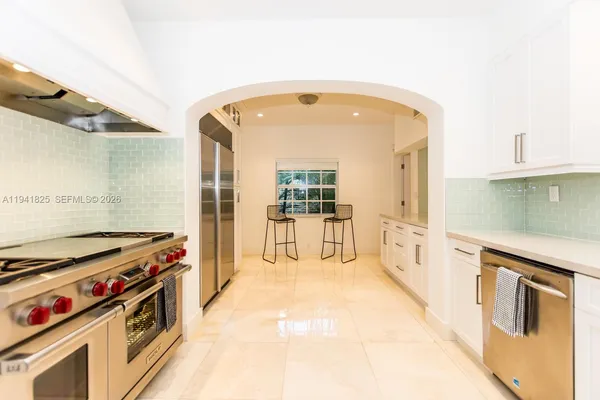 a kitchen with a stove and a cabinet