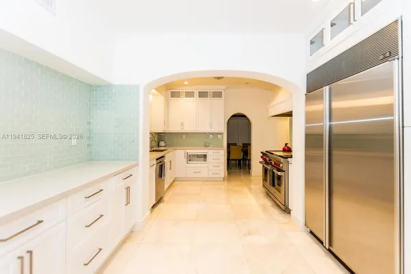 a view of a room with a large parking space and windows