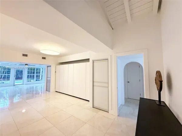 a view of dining room with chairs and chandelier