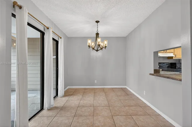 a view of a hallway with a chandelier