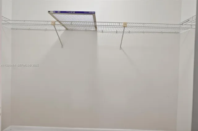 a view of a room with racks on the wall