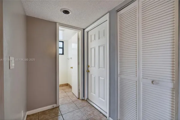 a view of a bathroom with a glass door