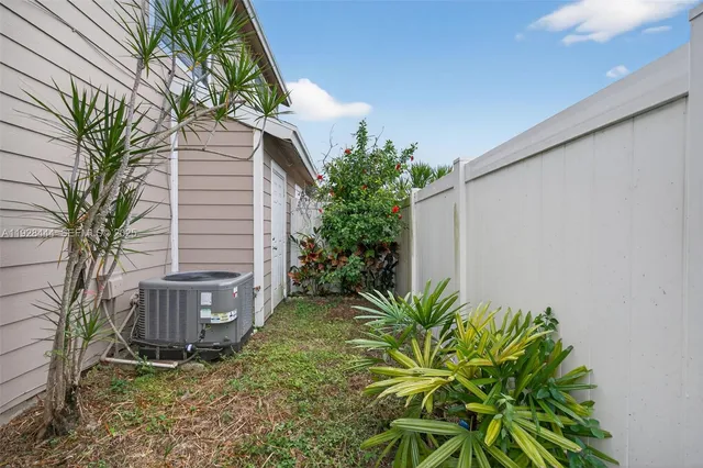 swimming pool view with a garden space