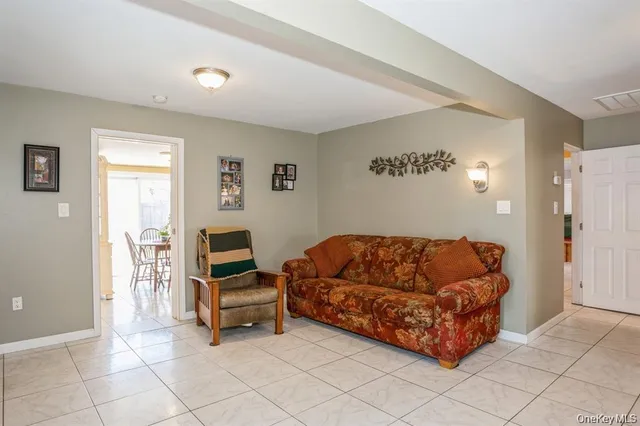 a living room with furniture and a table