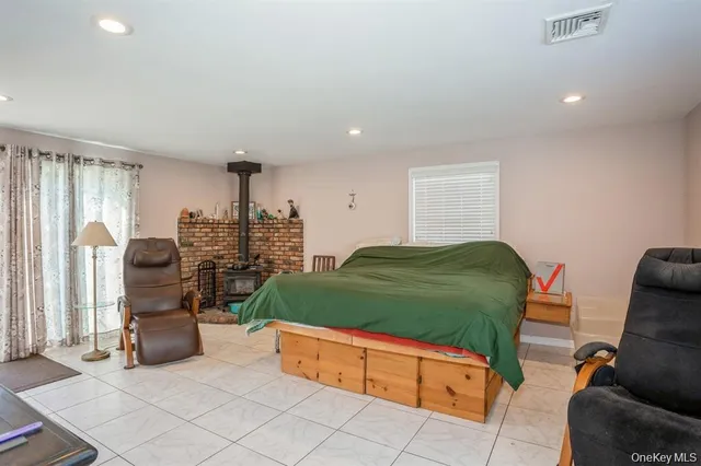 a room with lots of trees and windows