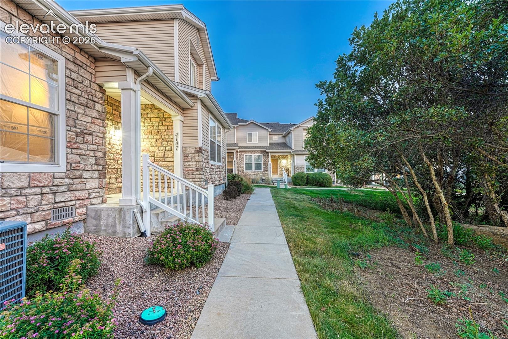4147 Diamond Ridge View Colorado Springs, CO 80918 - Photo 38 of 42 Meander along manicured sidewalks shaded by mature trees, highlighting the serene and walkable park-like setting of this community