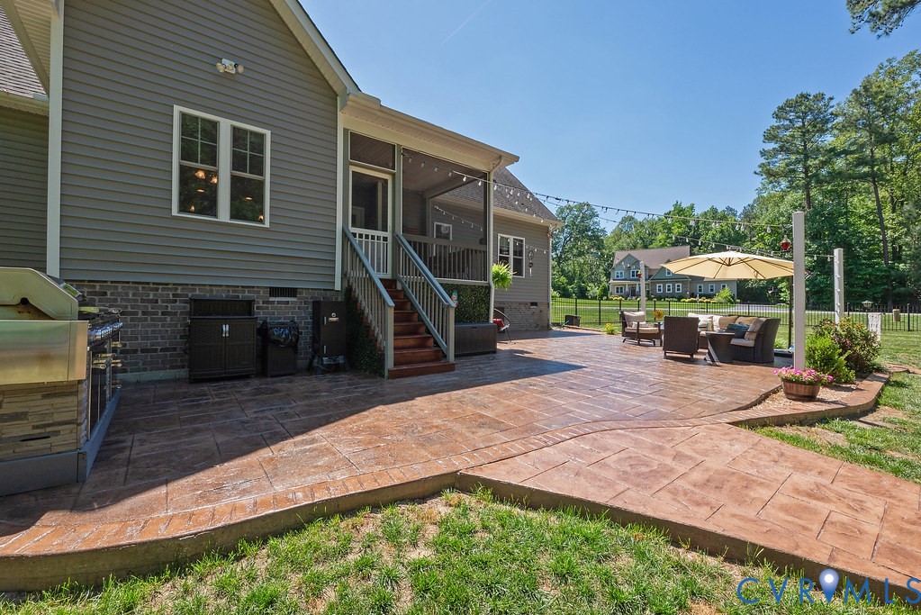 6446 Chestnut Church Road Mechanicsville, VA 23116 - Photo 37 of 49 Expansive stamped concrete patio featuring a built