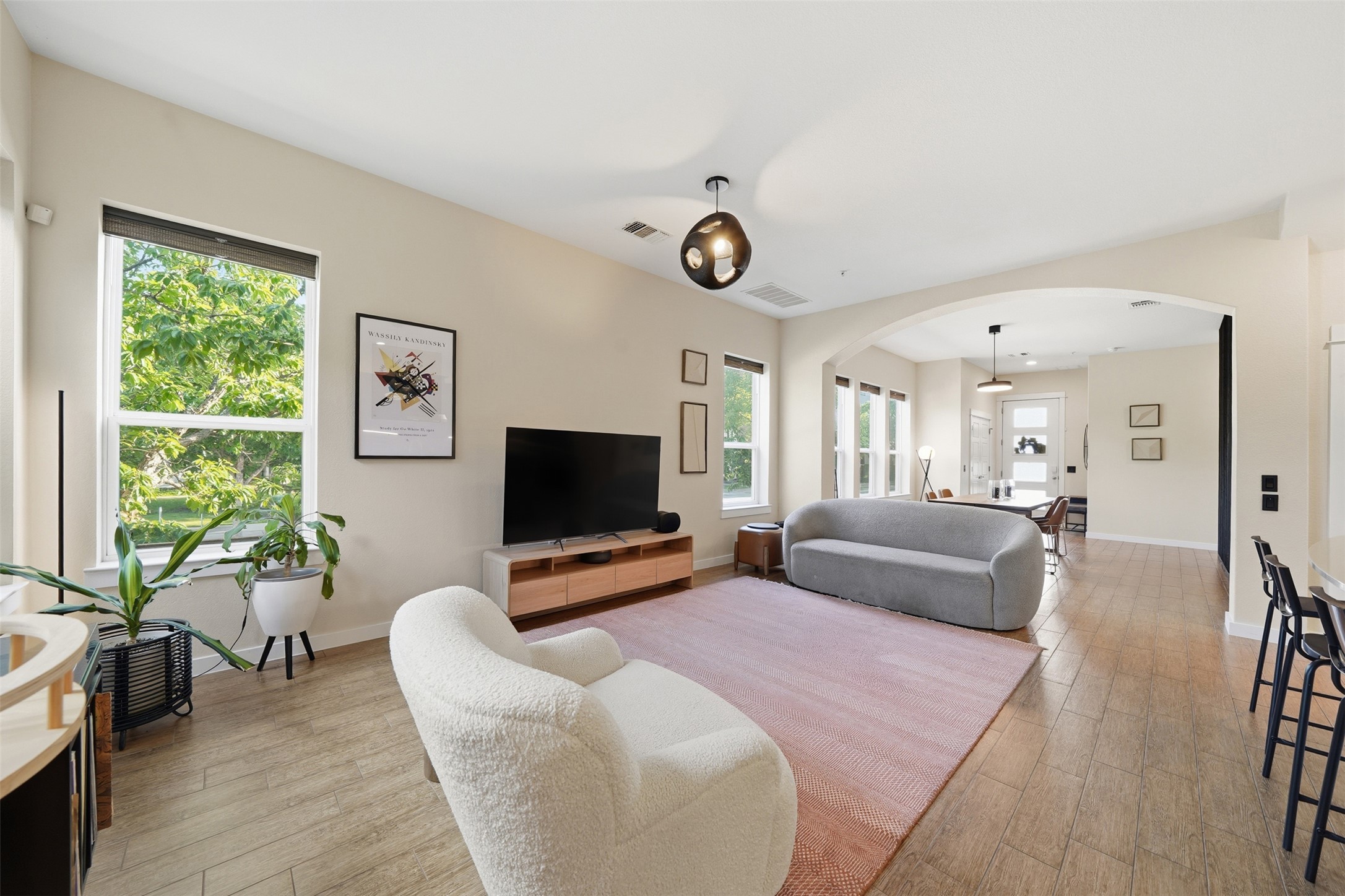 3901 Vaughan Street Austin, TX 78723 - Photo 5 of 37 Expansive living area featuring light wood-finish flooring and neutral wall tones