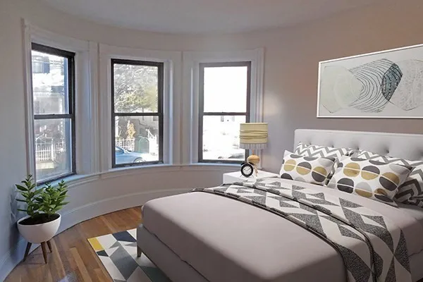 a spacious bedroom with a bed and a couch