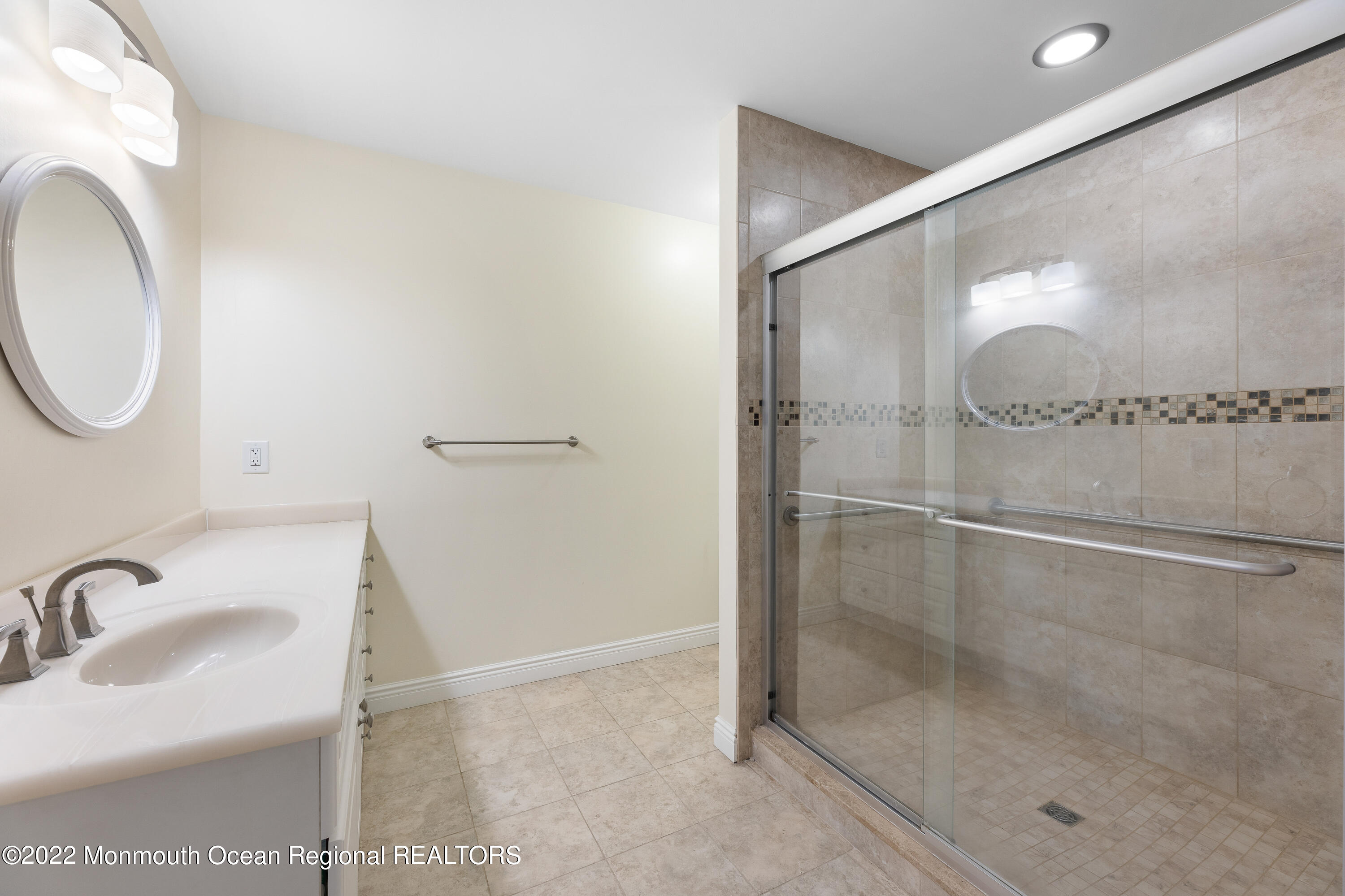 401 Leesville Road Jackson, NJ 08527 - Photo 13 of 25 a bathroom with a sink and a mirror