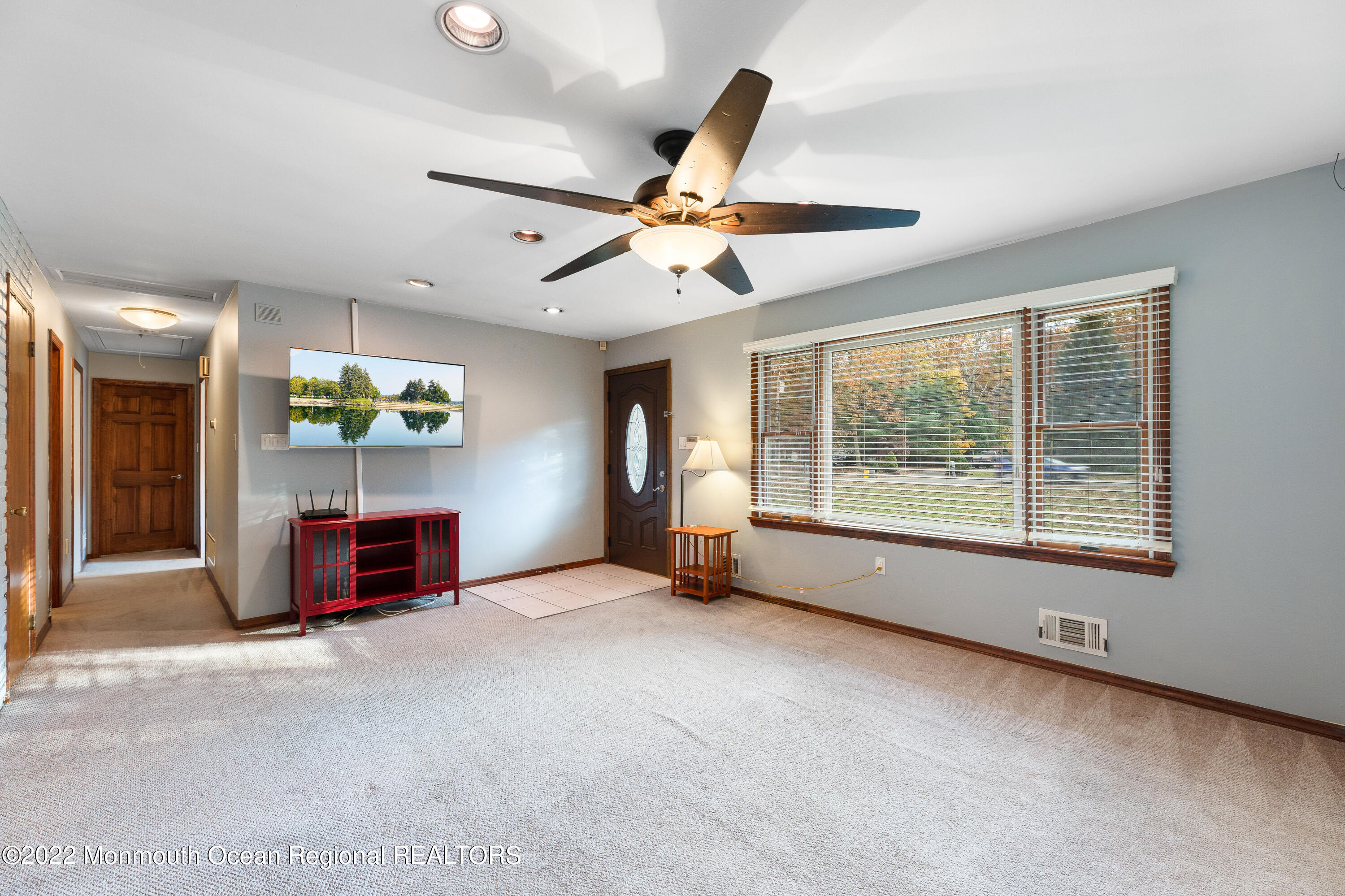 401 Leesville Road Jackson, NJ 08527 - Photo 3 of 25 a view of a livingroom with a ceiling fan and window
