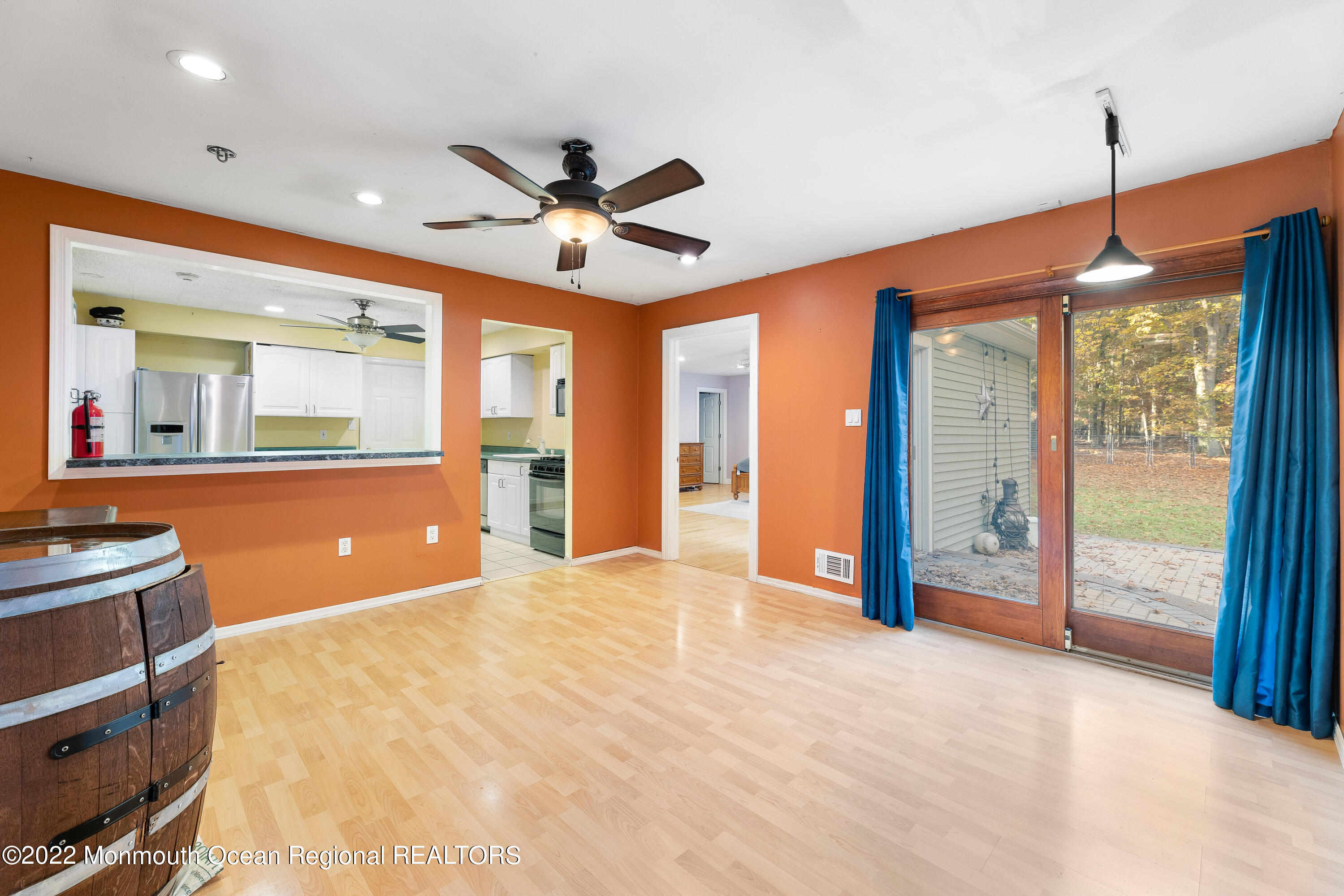 401 Leesville Road Jackson, NJ 08527 - Photo 7 of 25 a view of an empty room with a fireplace and a large window