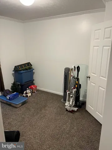 a view of room with gym equipment