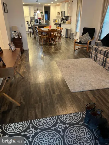 a outdoor space with lots of chairs a rug and a stove