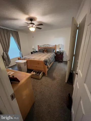 a bed room with a bed and a mirror