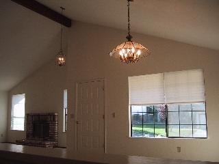 55 Sanchez Way Novato, CA 94947 - Photo 4 of 8 a view of a chandelier in big room with windows and chandelier