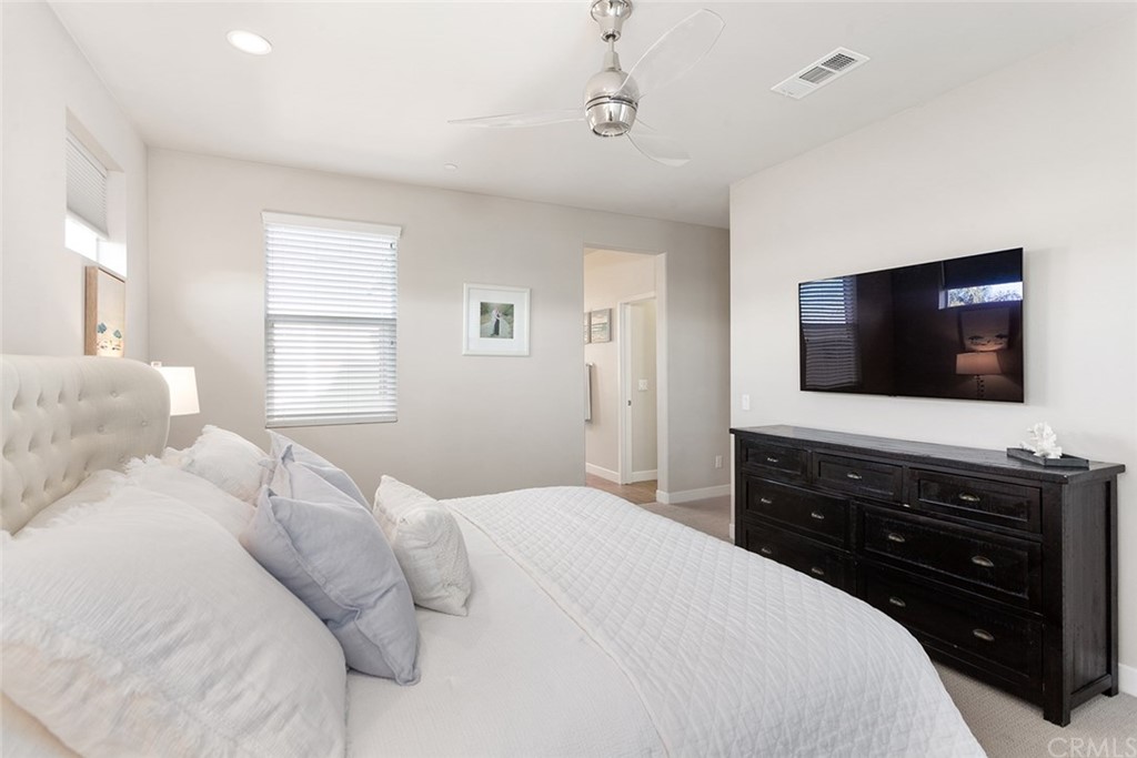 2189 Miner Street Costa Mesa, CA 92627 - Photo 13 of 21 a bedroom with a bed and a flat tv screen on dresser