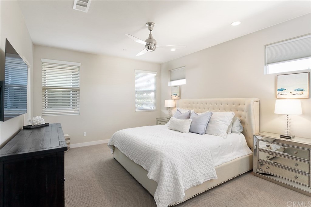 2189 Miner Street Costa Mesa, CA 92627 - Photo 14 of 21 a bedroom with a bed and a couch