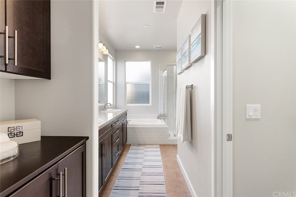 2189 Miner Street Costa Mesa, CA 92627 - Photo 16 of 21 a kitchen with a sink and a refrigerator