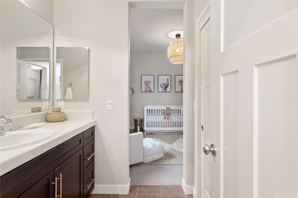 2189 Miner Street Costa Mesa, CA 92627 - Photo 18 of 21 a bathroom with a sink and a mirror