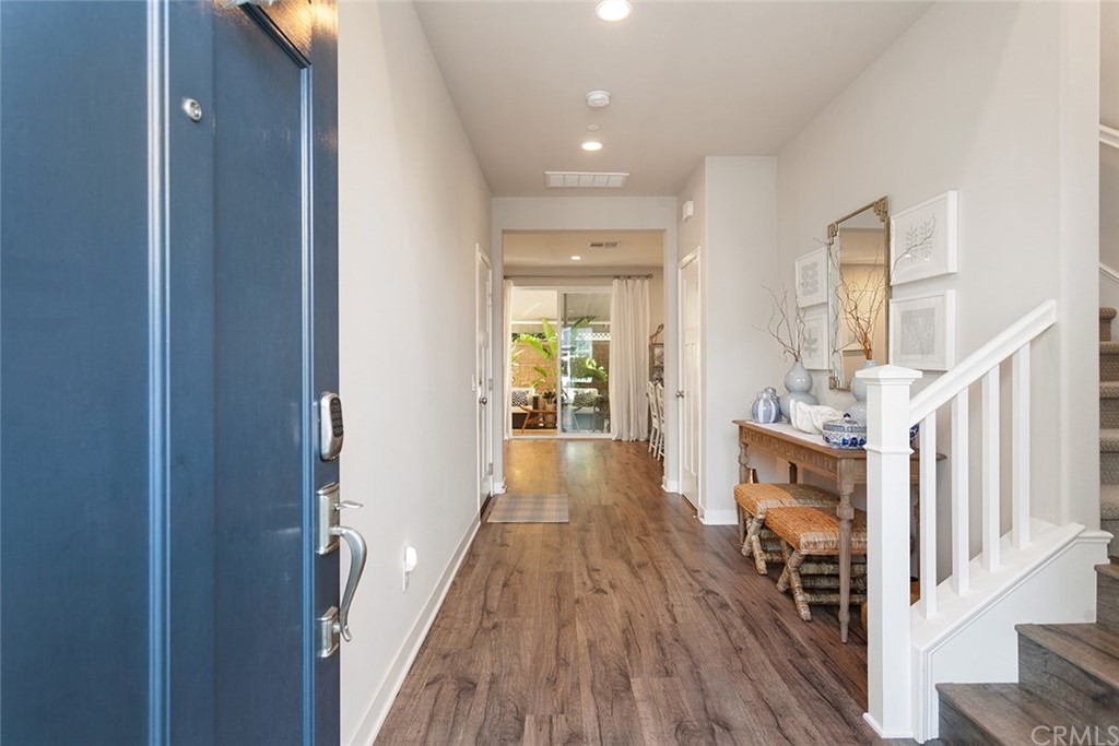 2189 Miner Street Costa Mesa, CA 92627 - Photo 3 of 21 a view of a hallway with wooden floor and staircase