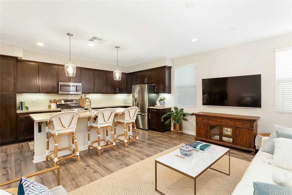 2189 Miner Street Costa Mesa, CA 92627 - Photo 4 of 21 a living room with fireplace furniture and a flat screen tv
