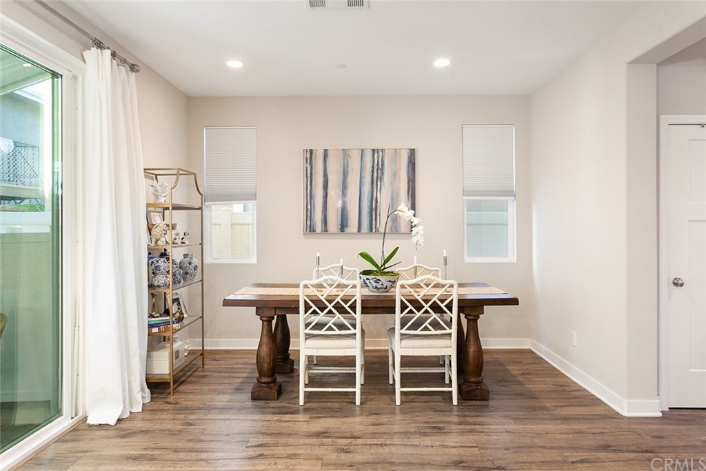 2189 Miner Street Costa Mesa, CA 92627 - Photo 9 of 21 a view of a a dining room with furniture window and wooden floor